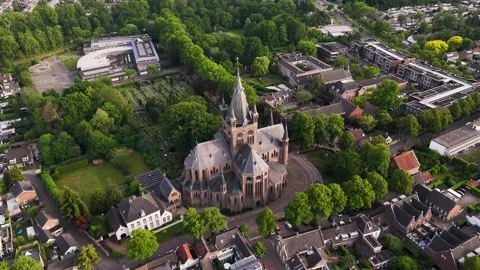 Aerial top-down rotational view of a historical church in a european town Vidéo 336594775