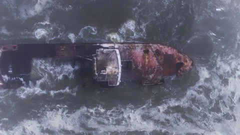 Aerial top down of rusting shipwreck on Namibia Skeleton Coast Stock Footage 341423778