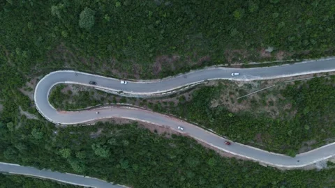 Aerial top down of a sharp hairpin turn on a mountain road 스톡 동영상 342872183