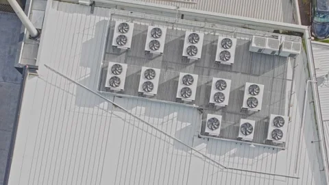 Aerial top down shot of air conditioning units on a building roof Stock Footage 340594741