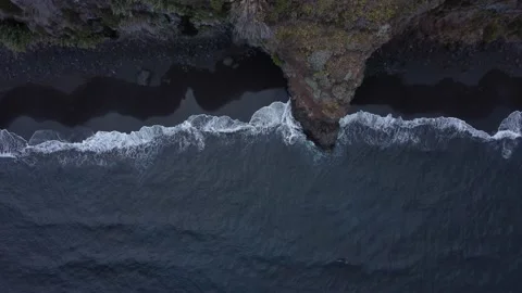 Aerial top down shot of black sand beach 스톡 동영상 163604562