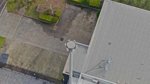 Aerial top down shot of a cellular tower transmitting a signal Stock Footage 340594868