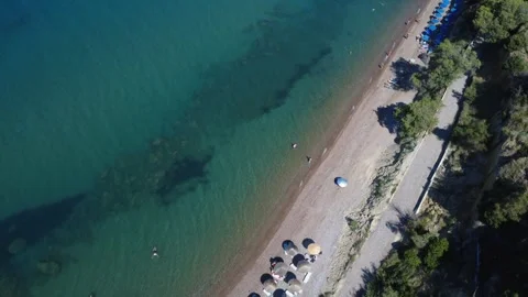 Aerial top down shot of an extensive golden beach with umbrellas. Stock Footage 343940981