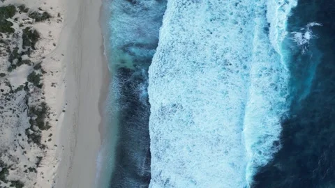 Aerial top down shot of foamy rolling wa... | Stock Video | Pond5