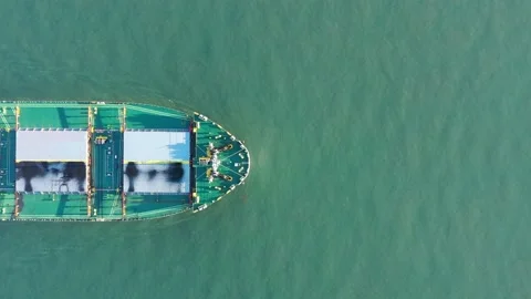 Aerial top down shot of Large Coal Ship moving through ocean water, Stock Footage 224657134