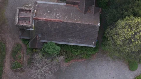 Aerial top down shot of an old mysterious house in the woods Stock Footage 341904465