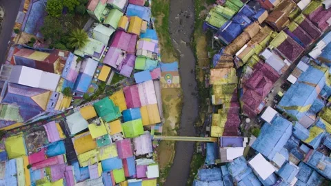 Aerial top-down shot of the rainbow village in Malang (Jodipan), Java, Indonesia Stock Footage 295359418