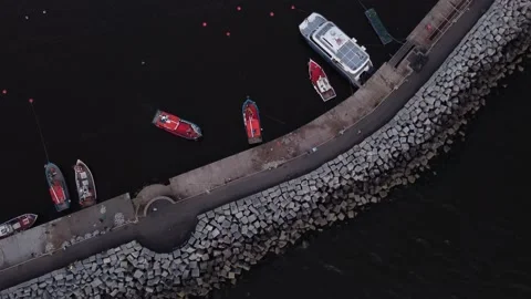 Aerial top down shot of red fishing port... | Stock Video | Pond5
