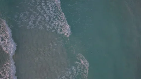 Aerial top down shot of rolling waves in... | Stock Video | Pond5