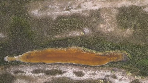 Aerial top down shot of rusty mineral lake Stock Footage 94450212