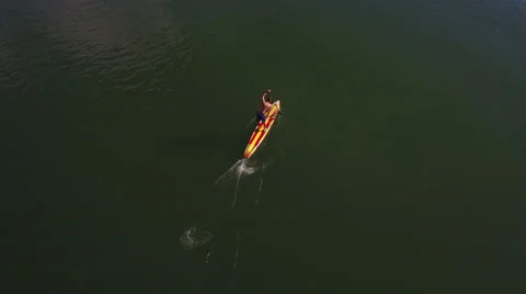 Aerial top down shot of the Stand up paddle boarder (SUP) paddling the columbia. Stock Footage 68626971