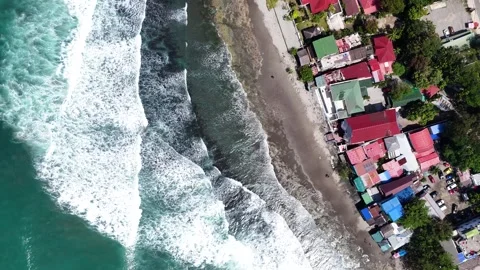 Aerial top down shot of tides coming upto the shore in the La Union province Stock Footage 291642152