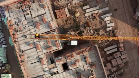 Aerial top Down Shot of a tower crane slewing unit over a construction site Stock Footage 143539305