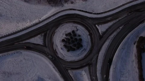 Aerial top down shot of traffic circle, moving with vehicles Stock Footage 230056697