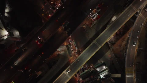 Aerial top down shot of traffic and road construction in India at night Stock Footage 304548334