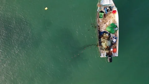 Aerial top down shot of two fishermen pu... | Stock Video | Pond5