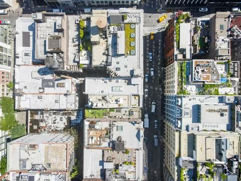Aerial top down of skyscraper buildings SoHo Manhattan on a sunny summer da.. Stock Photos