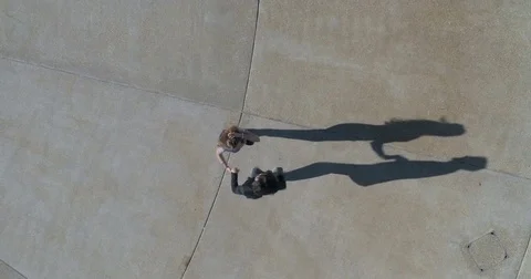Aerial top down slow motion view of Caucasian young couple dancing salsa Stock Footage 80885570