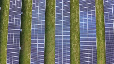 Aerial Top Down Of Solar Panels On Green Grass Sustainability Concept Stock Footage 338036634