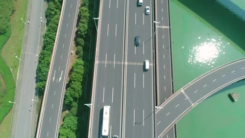 Aerial top down tilt view of a highway overpass multilevel junction with fast Stock Footage 165319992