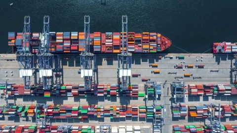 Aerial top down time lapse view of  large container cargo ship being unloaded Video stock 274267645