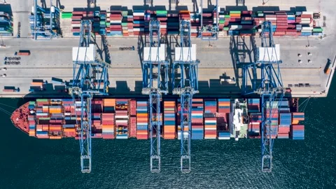Aerial top down time lapse view of  large container cargo ship being unloaded Video stock 274267729