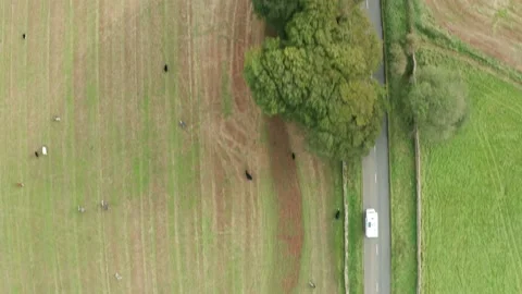 Aerial top down tracking shot of a white truck driving along a rural road Stock Footage 140448000