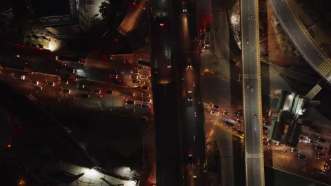 Aerial top down tracking shot of traffic and road construction in India Stock Footage 304548018