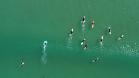 Aerial top down tracking surfer catching wave on longboard, Australia Video stock 133347965