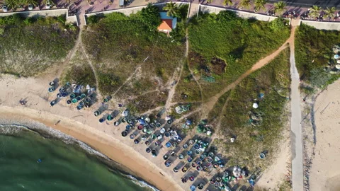 Aerial top down, traditional coracle Vietnamese fishing boats on beach Stock-Footage 168283760