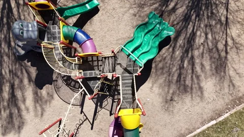 Aerial-Top down-Turning over empty Playground equipment Stock Footage 270877885