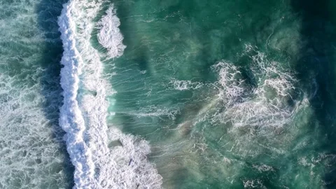 Aerial Top-Down Turquoise Ocean Waves Rolling Toward Sandy Shore Stock Footage 342236092