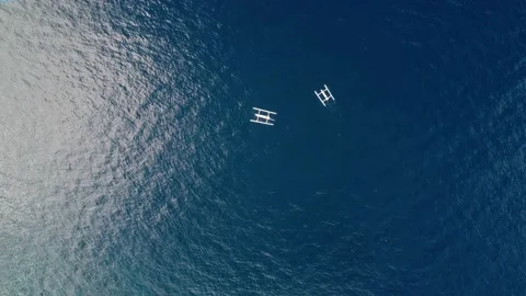 Aerial top down two pair fisherman boat in blue clear clean ocean Stock Footage 145787707