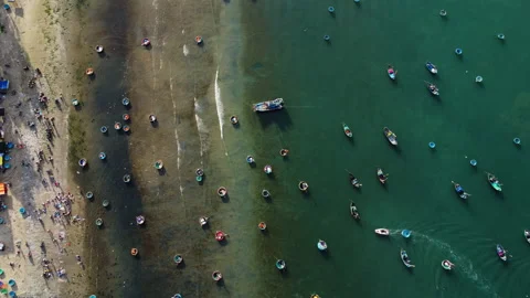 Aerial top down, Vietnamese round coracle fishing boats floating on beach Stock-Footage 171553643