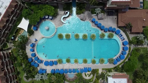 Aerial top down view of 5-star hotel swimming pool people swim 4k Stock Footage 262846382