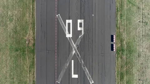 Aerial top down view of abandoned airport runway 4k Stock Footage 106299712