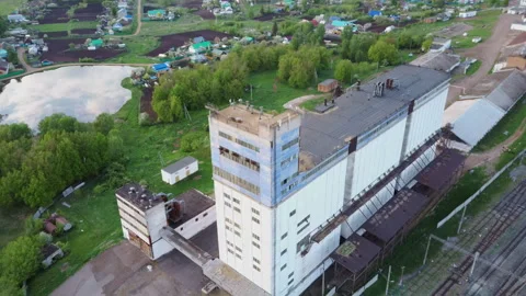 Aerial top down view of abandoned factory granary on cloudy day in city suburbs. Stock Footage 137698716