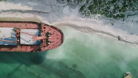 Aerial top down view of abandoned cargo ship. Bulk carrier ran aground after the Video stock 208390291