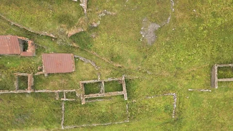 Aerial top down view abandoned village of Arsha ruins on hillside. Kazbegi .. Stock Footage 284237857