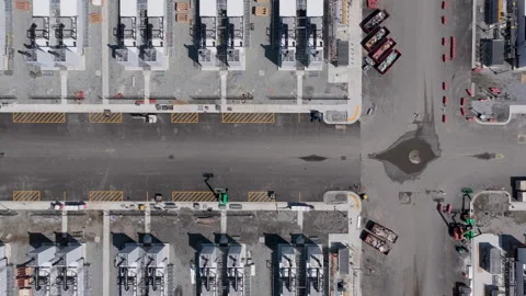Aerial top down view of an AI facility construction site with rows of equipment Stock-Footage 336519548