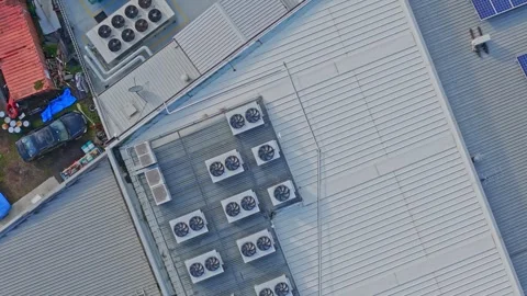 Aerial top down view of air conditioning units on a building roof Stock Footage 340568857