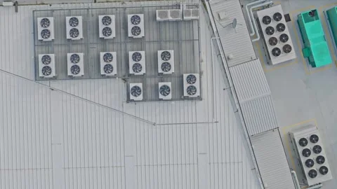 Aerial top down view of air conditioner units on factory roof Stock Footage 340594061