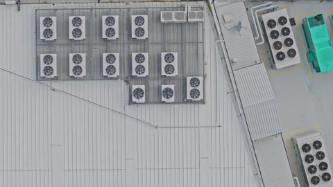 Aerial top down view of air conditioner units cooling a building Stock Footage 340594085