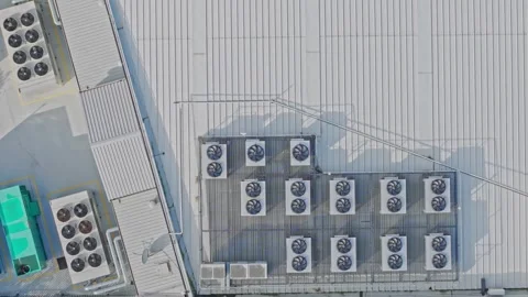 Aerial top-down view of air conditioning units on a rooftop Stock Footage 340594260