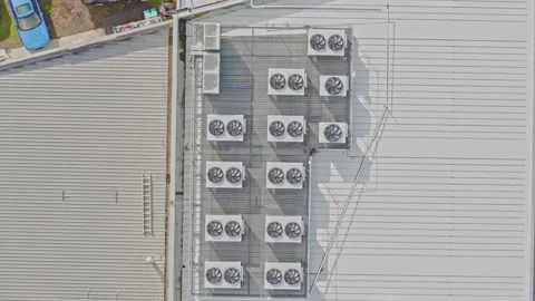 Aerial top down view of air conditioning units on a building roof Stock Footage 340594646