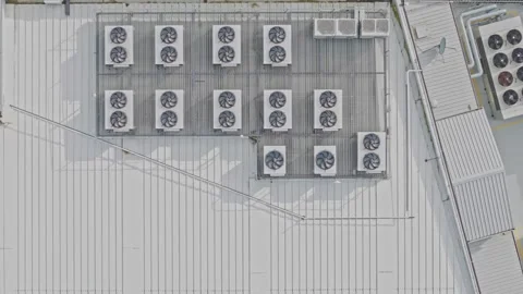 Aerial top down view of air conditioning units on a building rooftop Stock Footage 340603894