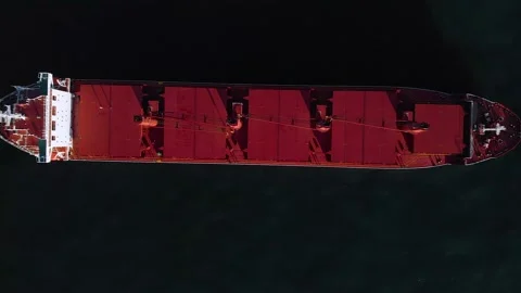 Aerial top down view of anchored cargo ship Stock Footage 235850368