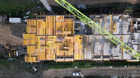 Aerial top-down view of an apartment building under construction, showing concre Stock Footage 330937152