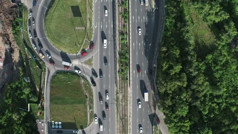 Aerial top down view of asphalt road with car traffic in city in summer evening Stock Footage 109225327