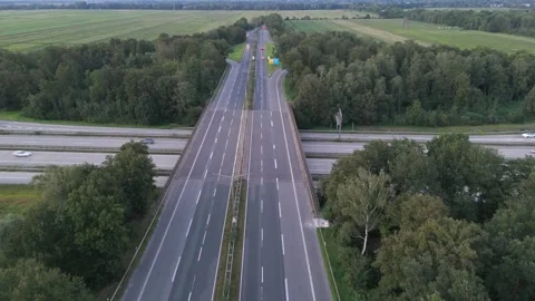 Aerial top down view of Autobahn highway through forest near Bremen Germany 스톡 동영상 336812114